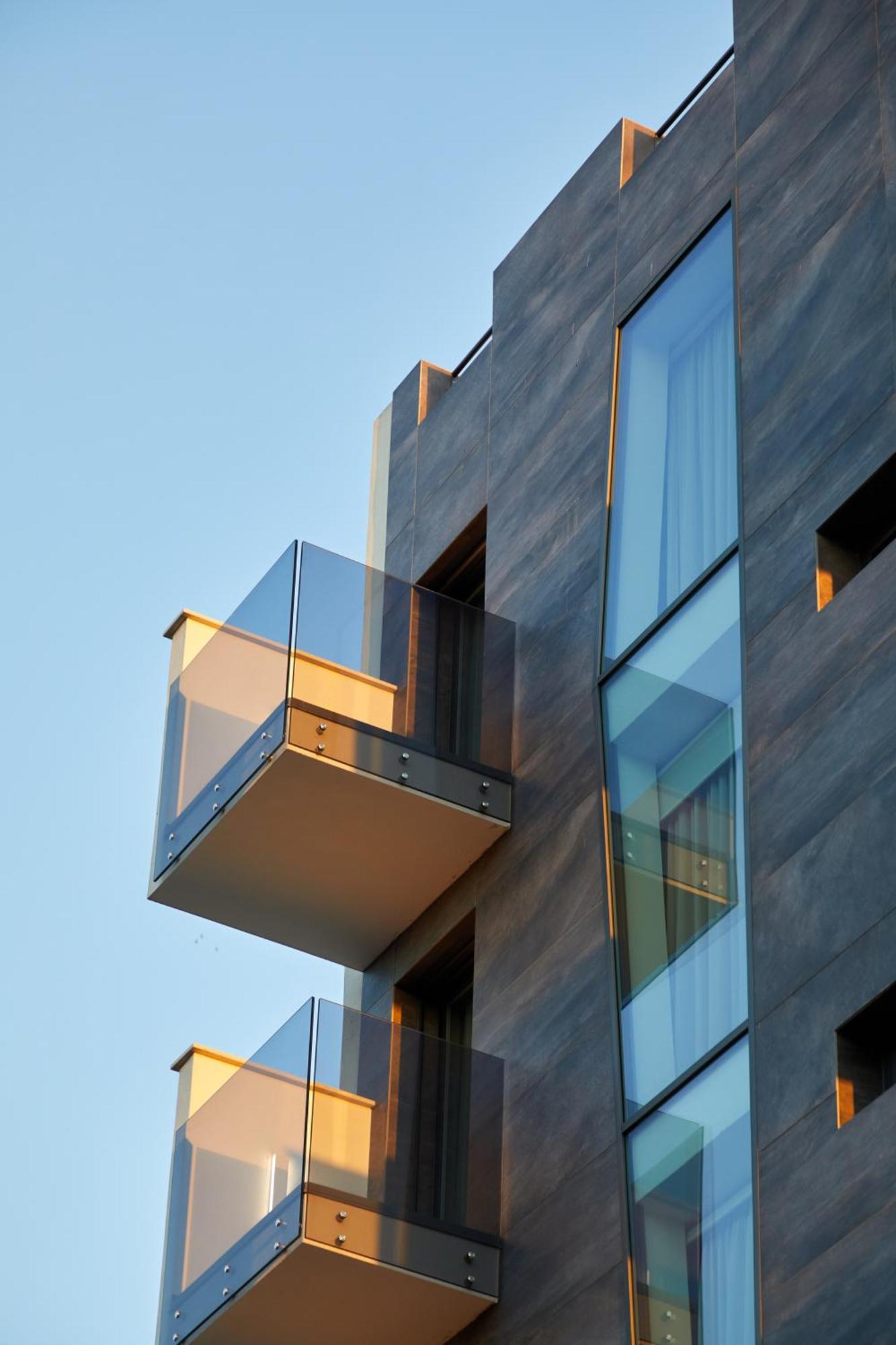 10. Glass House - Smart Rooms & Parking