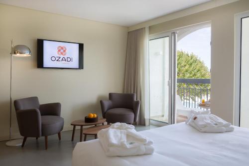 Ozadi Tavira Hotel
