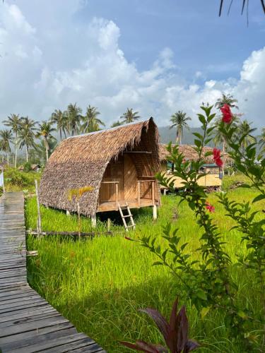 Palayan Paradise Huts