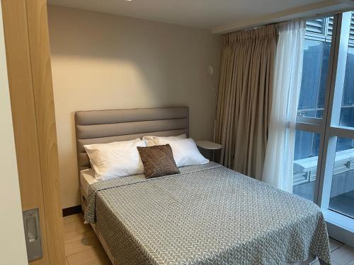 1 BR condo Uptown Parksuites BGC, high floor, morning sun