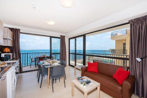 Islet Promenade Seafront Apartment with large Corner Terrace by Getawaysmalta