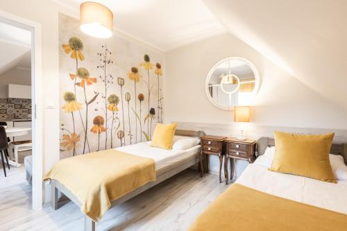 APARTEMENTY ''WERANDA'' z ogrodem w centrum