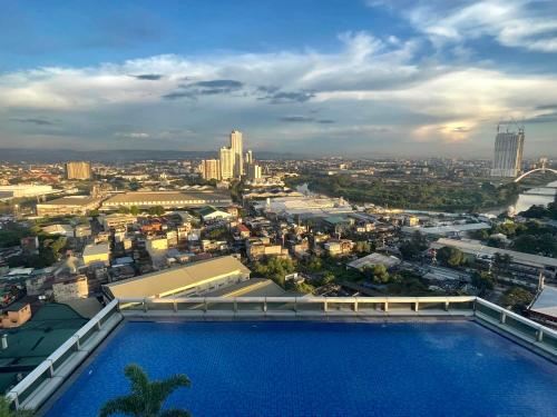 Classy 2BR Suite at Eastwood City with Pool and City Skyline View