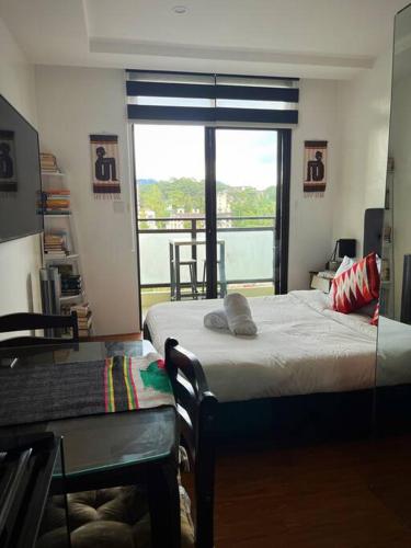 Chic Studio Unit with a Balcony and a View in Megatower Residences 3