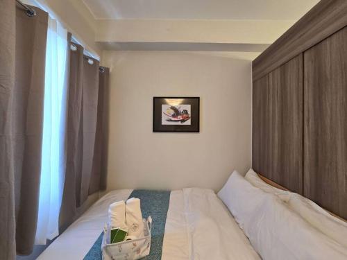 1BR Condotel with Balcony at FAME Residences #FM33