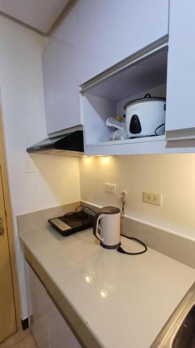 Condo Studio with Pool for Staycation