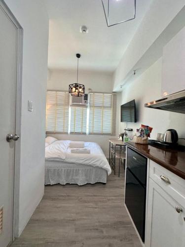 Studio One Condominium, Alabang - Bluu - Fiber Wi-Fi, Netflix-ready