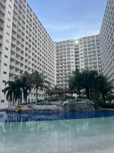 Industrial Design Bachelor's Pad with Pool View in Shore Residences