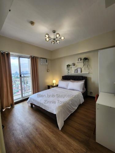 Zinnia Tower 2br condo with QC Cityview