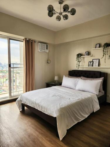 Zinnia Tower 2br condo with QC Cityview