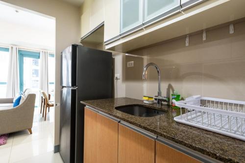 One Uptown Residence BGC 2BR Cor unit with balcony , washer