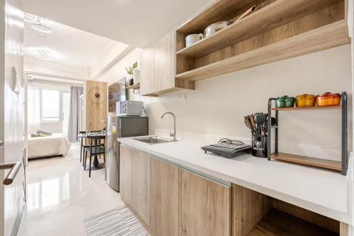 Modern Minimalist Studio with Balcony & Sunset View