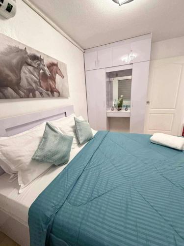 2BR Condo with Free Pool and Wifi beside SM Ecoland