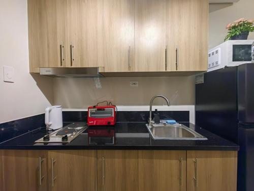 1BR Condotel with Balcony at FAME Residences #FM47-1