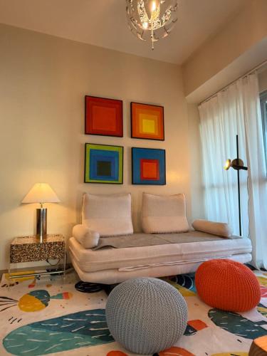 Modern 1BR with Balcony Facing Infinity Pool Manila Bay Sunset Near Airports OKADA Solaire MOA