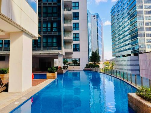 BGC Cozy Condo - Pool, Wi-Fi - Suite 17