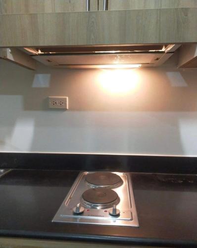 S Residence, 1bedroom with balcony, with own kitchen and washing machine, walking distance to Mall of Asia and near in Manila Airport, can cook and wash clothes