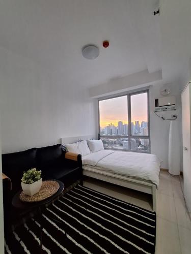 Mi Casa - Cozy Studio with FREE access to Fitness Centre, swimming pool and stunning City View located near the CBD of Ortigas, Makati, BGC