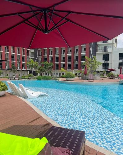 Dagos condo Primeworld with balcony and pool view