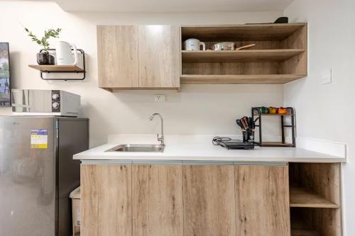 Modern Minimalist Studio with Balcony & Sunset View