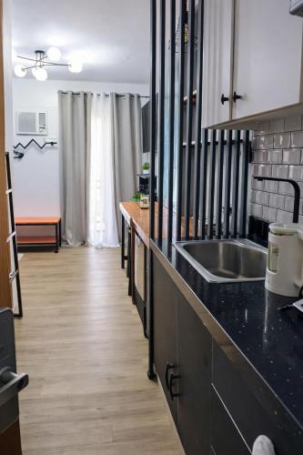 Antara-QueenBed-Balcony-HotShower-WorkCoffee Station-FullKitchen